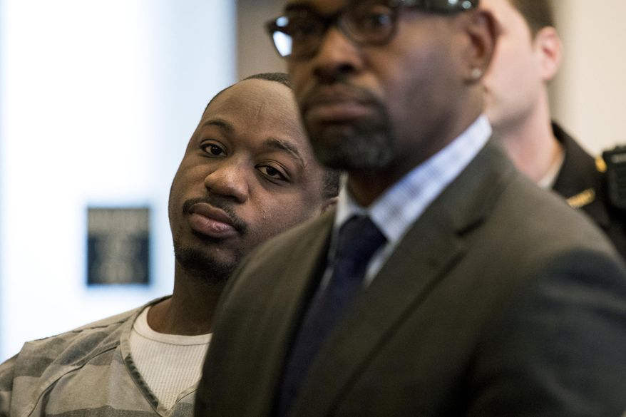 Cornell Beckley, left, listens to Common Pleas Judge Steven Martin, during his arraignment at the Hamilton County Courthouse Tuesday, April 24, 2018. Beckley is scheduled to stand trial next month in connection with the mass shooting at the Cameo nightclub. Beckley, 28, has been accused of paying off witnesses. Court documents say Justin Watson is involved in two of the alleged bribery incidents. (Meg Vogel/The Cincinnati Enquirer via AP)