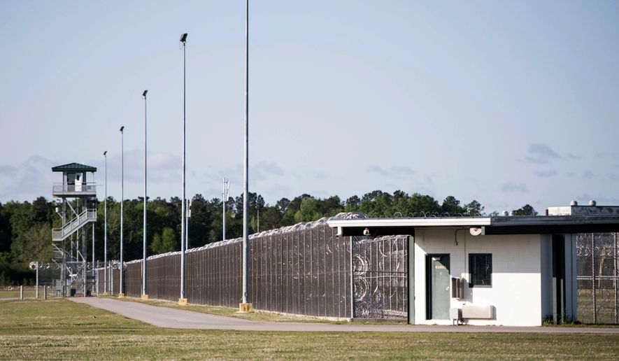 FILE - This April 16, 2018 file photo shows the Lee Correctional Institution in Bishopville, S.C. Multiple inmates were killed and others seriously injured amid fighting between prisoners inside the maximum security prison in South Carolina. South Carolina prison officials have for years blamed cellphones for contributing to inmate violence. After a bloody riot at a maximum-security prison last weekend that left seven inmates dead, they find themselves once again asking federal officials to grant waivers and change laws to let them block the signals of these contraband devices. (AP Photo/Sean Rayford, File)