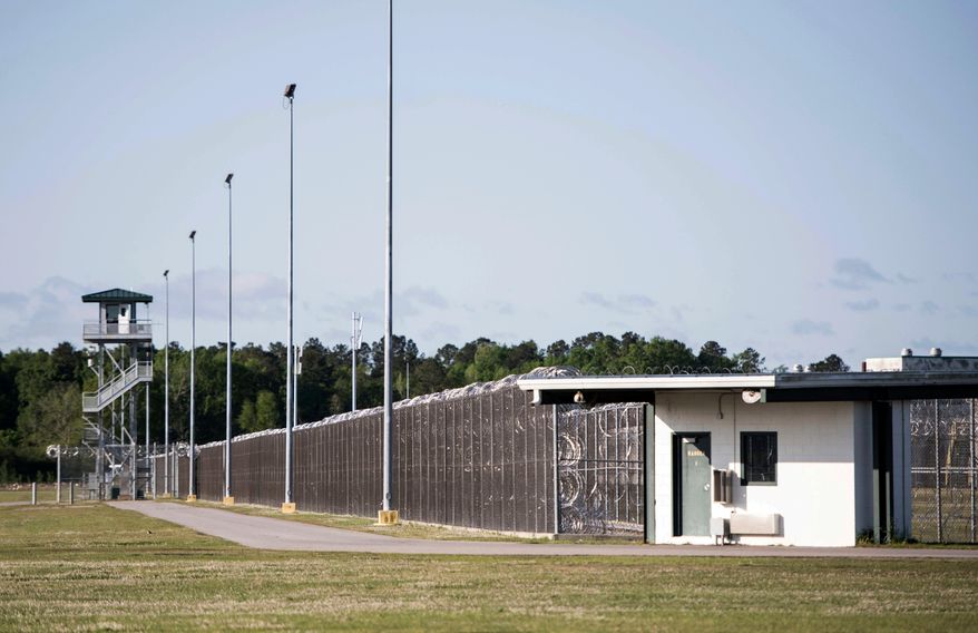 FILE - This April 16, 2018 file photo shows the Lee Correctional Institution in Bishopville, S.C. Multiple inmates were killed and others seriously injured amid fighting between prisoners inside the maximum security prison in South Carolina. South Carolina prison officials have for years blamed cellphones for contributing to inmate violence. After a bloody riot at a maximum-security prison last weekend that left seven inmates dead, they find themselves once again asking federal officials to grant waivers and change laws to let them block the signals of these contraband devices. (AP Photo/Sean Rayford, File)