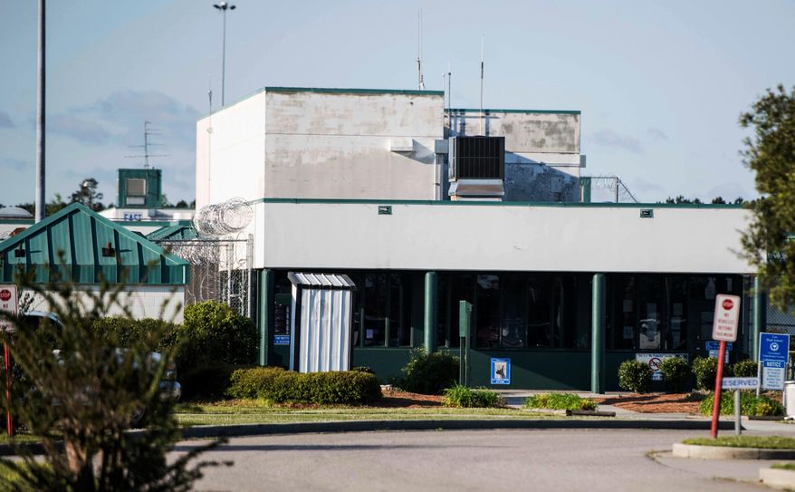 FILE - This Monday, April 16, 2018 file photo shows the Lee Correctional Institution, in Bishopville, S.C. Multiple inmates were killed and others seriously injured amid fighting between prisoners inside the maximum security prison in South Carolina. South Carolina prison officials have for years blamed cellphones for contributing to inmate violence. After a bloody riot at a maximum-security prison that left seven inmates dead, they find themselves once again asking federal officials to grant waivers and change laws to let them block the signals of these contraband devices. (AP Photo/Sean Rayford, File)
