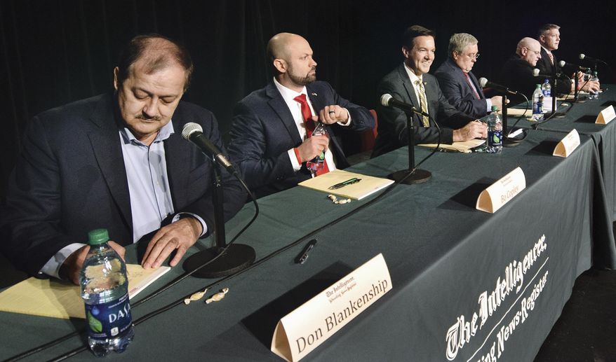Candidates, from left, Don Blankenship, of Williamson, Bo Copley, of Delbarton; U.S. Rep. Evan Jenkins, R-W.Va., of Huntington, West Virginia Attorney General Patrick Morrisey, of Charles Town, Jack Newbrough, of Weirton, and Tom Willis, of Martinsburg, participate in a debate sponsored by The Intelligencer and Wheeling News Register at Wheeling Jesuit University in Wheeling, W.Va., Monday, April 23, 2018. The Republican candidates hoping to oust U.S. Sen. Joe Manchin in the fall took repeated turns attacking the incumbent Democrat's record while aligning themselves with President Donald Trump during the forum on Monday night. (Scott McCloskey/The Intelligencer via AP)