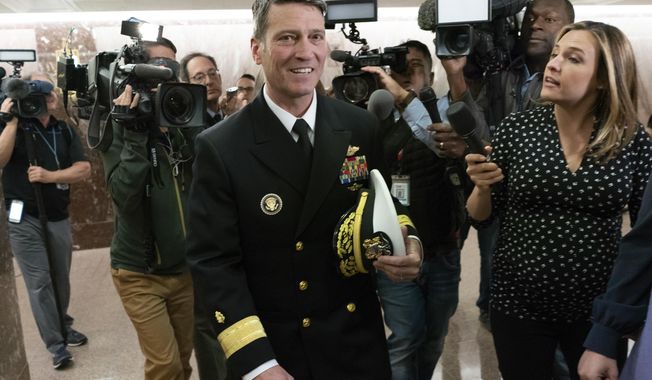Rear Adm. Ronny Jackson, President Donald Trump&#x27;s choice to be secretary of the Department of Veterans Affairs, leaves a Senate office building after meeting individually with some members of the committee that would vet him for the post, on Capitol Hill in Washington, Tuesday, April 24, 2018.  (AP Photo/J. Scott Applewhite)