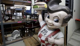 In this Thursday, April 19, 2018 photo, a Big Boy statue from the restaurant chain popular in the 1970s and 1980s and other items sits in the basement of the Wisconsin Historical Society&#39;s headquarters in Madison, Wis. Construction of the $46 million State Archive Preservation Facility is complete but now the task of moving artifacts to the facility is underway. The effort is expected to take up to 18 months. (Steve Apps/Wisconsin State Journal via AP)