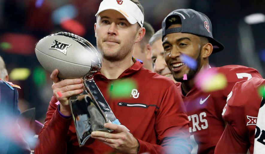 FILE - In this Dec. 2, 2017, file photo, Oklahoma head coach Lincoln Riley holds the Big 12 Conference championship NCAA college football game trophy after Oklahoma defeated TCU, in Arlington, Texas. Riley has already led Oklahoma to the College Football Playoff and another Big 12 title with a Heisman Trophy-winning quarterback. Now Riley has completed his first spring as head coach of the Sooners. “Yeah, we did this one backward kind of ... having been through a whole season, now this is kind of my first spring practice,” Riley said.(AP Photo/Tony Gutierrez, Fil)