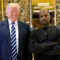 Kanye West poses for a picture in the lobby of Trump Tower in New York with then-President-elect Donald Trump, Dec. 13, 2016. (AP Photo/Seth Wenig) ** FILE **