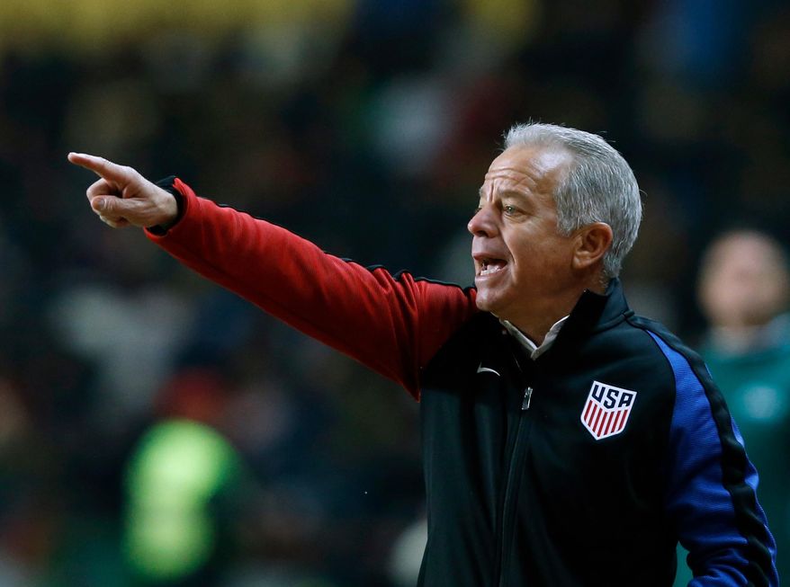 FILE - In this Nov. 14, 2017, file photo, U.S. interim coach Dave Sarachan gestures during an international friendly soccer match between Portugal and U.S. in Leiria, Portugal. Midfielders Weston McKennie and Tyler Adams have played their way onto the top tier of the U.S. player pool along with defender Matt Miazga, according to interim coach Dave Sarachan, who says the trio would receive strong consideration for a World Cup roster if the Americans were headed to Russia in June. (AP Photo/Pedro Rocha, File)