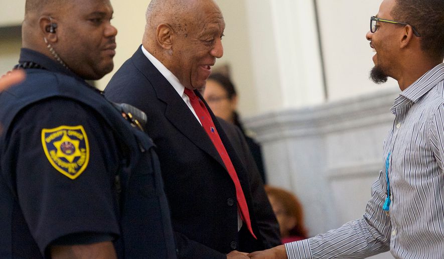 Actor and comedian Bill Cosby, center, is greeted as he arrives at the Montgomery County Courthouse for jury deliberations in his sexual assault retrial, Thursday, April, 26, 2018, in Norristown, Pa. (Mark Makela//Pool Photo via AP)