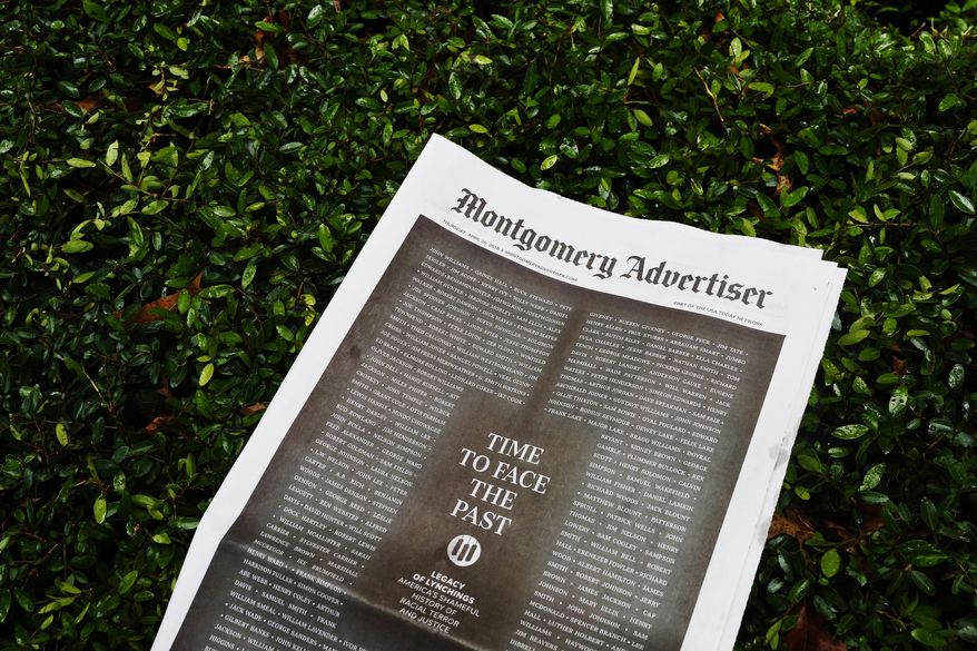 The Montgomery Advertiser newspaper lays on a hedge on Thursday, April 26, 2018, in Montgomery, Ala. (AP Photo/Brynn Anderson)