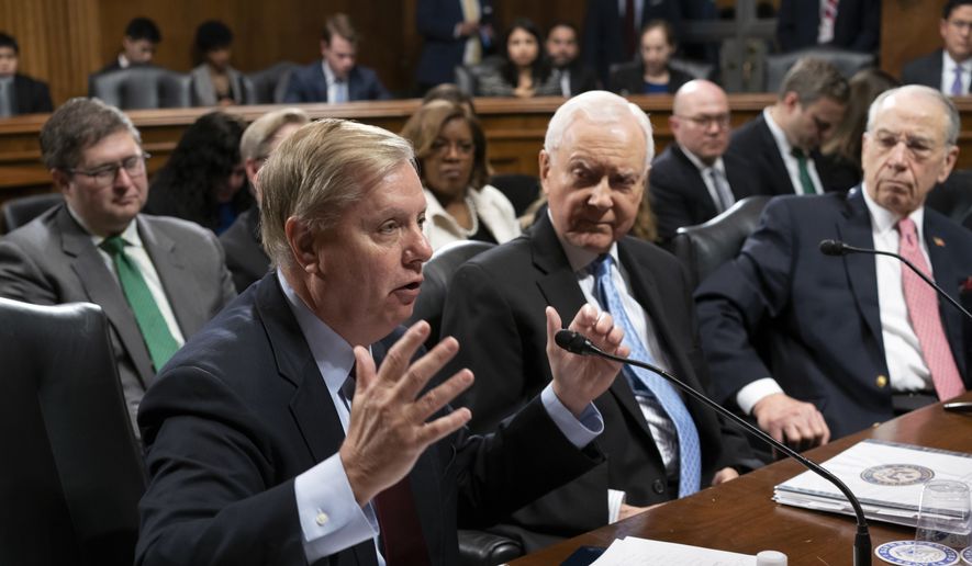 From left, Sen. Lindsey Graham, R-S.C., Sen. Orrin Hatch, R-Utah, and Senate Judiciary Committee Chairman Chuck Grassley, R-Iowa, continue discussions on Capitol Hill in Washington, Thursday, April 26, 2018. (AP Photo/J. Scott Applewhite) ** FILE **