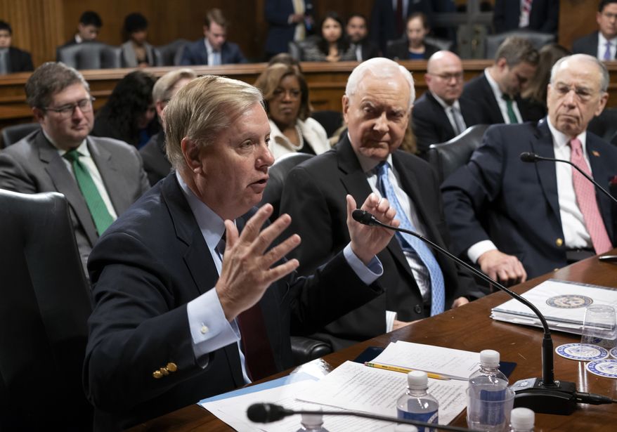 From left, Sen. Lindsey Graham, R-S.C., Sen. Orrin Hatch, R-Utah, and Senate Judiciary Committee Chairman Chuck Grassley, R-Iowa, continue discussions on Capitol Hill in Washington, Thursday, April 26, 2018. (AP Photo/J. Scott Applewhite) ** FILE **