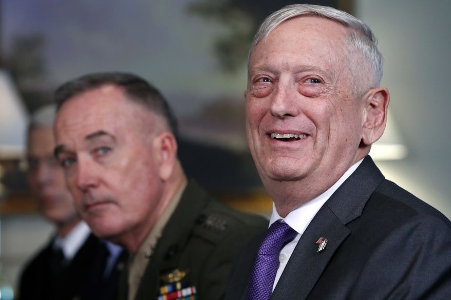 Then-Defense Secretary Jim Mattis, right, next to Joint Chiefs Chairman Gen. Joseph Dunford, smiles during a meeting with the Israeli delegation, including Israeli Minister of Defense Avigdor Lieberman, Thursday April 26, 2018, at the Pentagon. (AP Photo/Jacquelyn Martin) ** FILE **