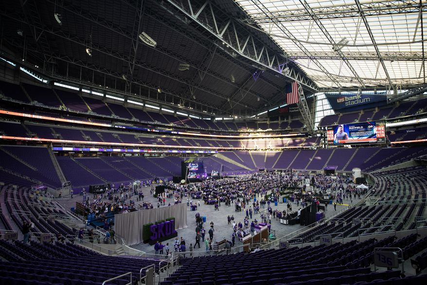 Fans attend the Minnesota Vikings' NFL football draft party Thursday, April 26, 2018, at U.S. Bank Stadium in Minneapolis. (Carlos Gonzalez/Star Tribune via AP)