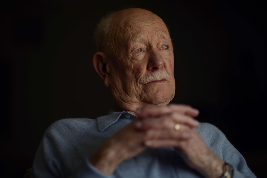 In this April 11, 2018, photo, Armand Sedgeley, 96, poses for a photo in Lakewood, Colo. Even at 96, Sedgeley recalls long-ago events with the clarity of the raw, 22-year-old Army airman he was on the day he fell from the sky over Italy. (Hyoung Chang/The Denver Post via AP)