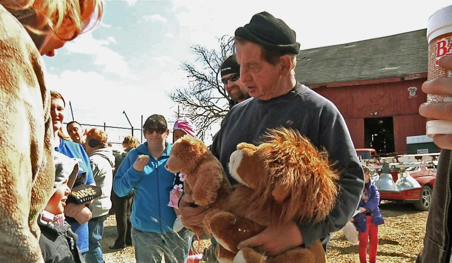 FILE – In this April 4, 2015, file photo, Kenny Hetrick, owner of Tiger Ridge Exotics, holds stuffed toy animals as he speaks to visitors at an Easter egg hunt fundraiser in Stony Ridge, Ohio. The Hetrick family, whose tigers and other exotic animals were seized in a raid by Ohio authorities, lost what&#x27;s likely their final court challenge seeking the animals return to their roadside sanctuary. The state&#x27;s agriculture department said the decision issued Wednesday, April 25, 2018, will allow it to begin handing over permanent ownership of the animals to the sanctuaries where they now are housed. (AP Photo/Mike Householder, File)
