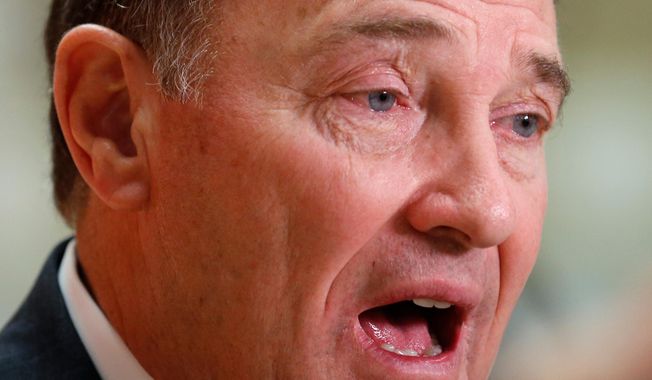 FILE - In this April 16, 2018, file photo, shows Utah Gov. Gary Herbert speaking with reporters following a bill signing ceremony at the Meadowbrook Elementary School, in Bountiful, Utah. Herbert says he will oppose ballot initiatives allowing medical marijuana and expanding Medicaid in his state, but is okay with two other potential measures in November. (AP Photo/Rick Bowmer, File)