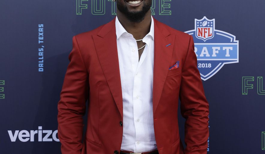Alabama's Rashaan Evans poses for photos on the red carpet during the first round of the NFL football draft, Thursday, April 26, 2018, in Arlington, Texas. (AP Photo/Eric Gay)