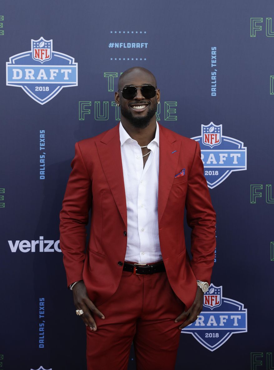 Alabama's Rashaan Evans poses for photos on the red carpet during the first round of the NFL football draft, Thursday, April 26, 2018, in Arlington, Texas. (AP Photo/Eric Gay)