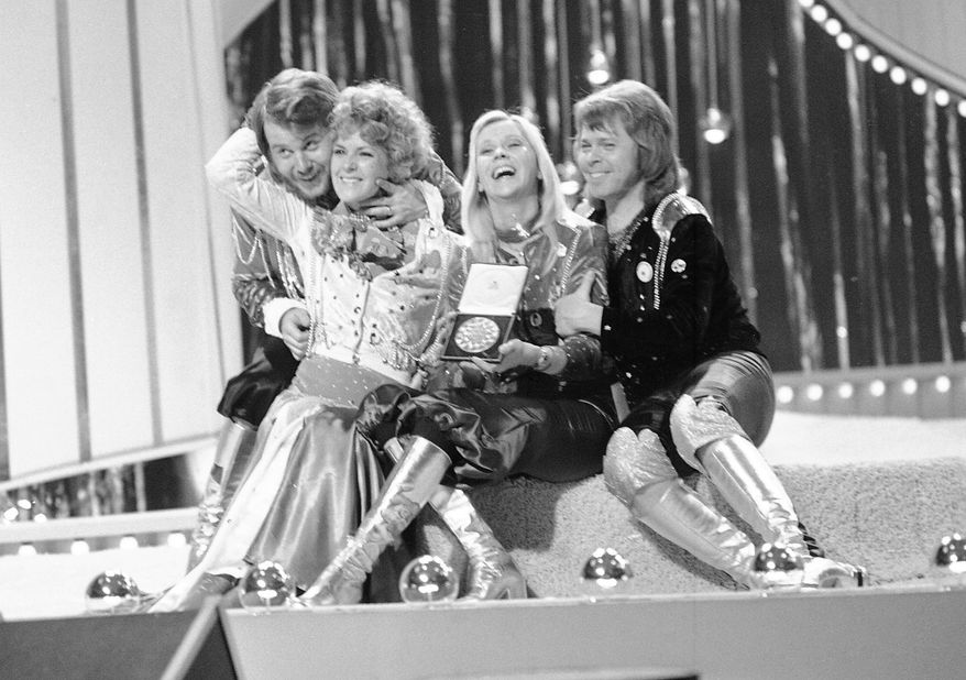 In this April 6, 1974 file photo, Swedish pop group ABBA celebrate winning the 1974 Eurovision Song Contest on stage at the Brighton Dome in England with their song Waterloo. From left, Benny Andersson, Anni-Frid Lyngstad (Frida), Agentha Faltskog, and Bjorn Ulvaeus. The members of ABBA announced on Friday April 27, 2018, they have recorded new material for the first time in 35 years. (AP Photo/Robert Dear, File)