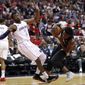 Washington Wizards guard John Wall (2) fouls Toronto Raptors forward OG Anunoby, right, during the first half of Game 6 of an NBA basketball first-round playoff series Friday, April 27, 2018, in Washington. (AP Photo/Alex Brandon)
