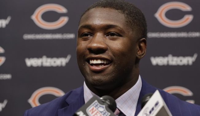Chicago Bears first round draft pick, University of Georgia linebacker Roquan Smith, smiles during an introductory NFL football news conference Friday, April 27, 2018, in Lake Forest , Ill. (AP Photo/Charles Rex Arbogast)