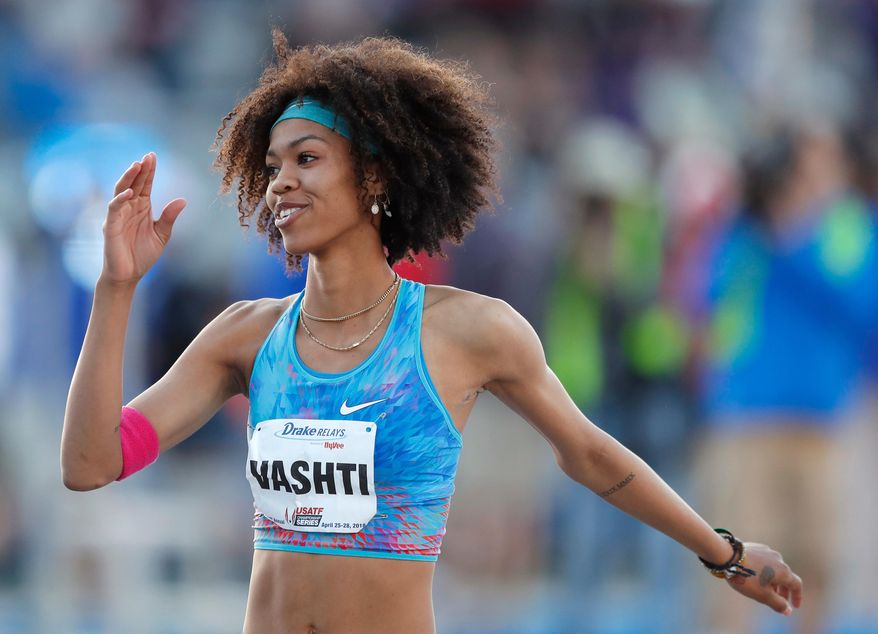 Vashti Cunningham waves to the crowd after winning the women's special high jump at the Drake Relays athletics meet Friday, April 27, 2018, in Des Moines, Iowa. (AP Photo/Charlie Neibergall)