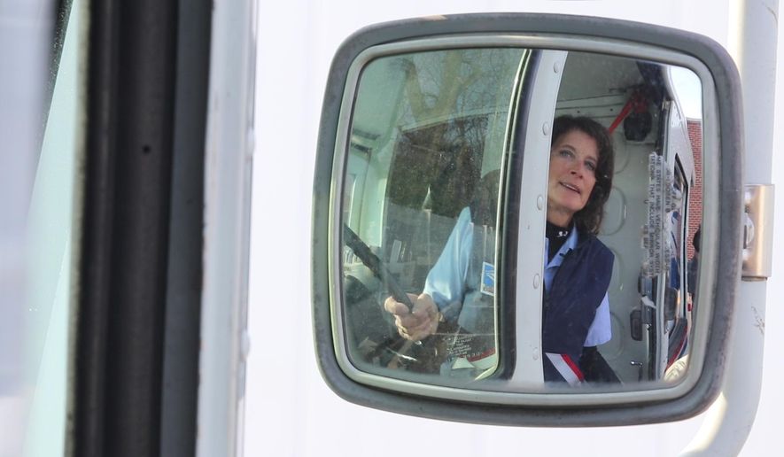 Robin O'Neill, of Brick, a mail carrier in Spring Lake and Spring Lake Heights who is being honored for driving accident-free for 30 years, prepares for her mail route at the Spring Lake Post Office in Spring Lake, NJ Thursday April 12, 2018. (Tanya Breen /The Asbury Park Press via AP)
