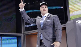 Florida&#39;s Taven Bryan walks on stage after being selected by the Jacksonville Jaguars during the first round of the NFL football draft, Thursday, April 26, 2018, in Arlington, Texas. (AP Photo/David J. Phillip)