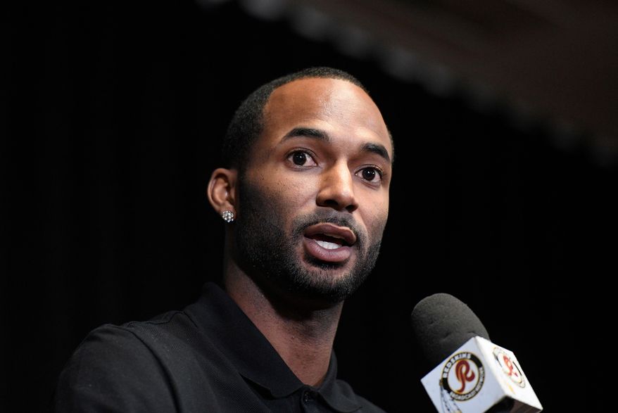 FILE - In this March 15, 2018, file photo, newly signed Washington Redskins wide receiver Paul Richardson Jr. speaks during the NFL football team's news conference in Ashburn, Va. Virginia State Police won't release video of a traffic stop involving a Washington Redskins wide receiver who said a state trooper asked if he was a gang member or drug dealer. Paul Richardson Jr.'s tweets about the questions he was asked during a Tuesday traffic stop prompted an internal review by state police. The department said Friday, April 27, 2018, that it was declining a public records request by The Associated Press for video taken from the trooper's in-car camera. (AP Photo/Nick Wass, File)