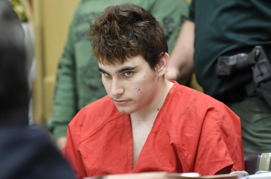Florida school shooting suspect Nikolas Cruz, looks up while in court for a hearing in Fort Lauderdale, Fla., Friday, April 27, 2018. The hearing is expected to deal with several procedural issues possibly including setting an initial trial date. Cruz is charged with 17 counts of murder and 17 counts of attempted murder in the Feb. 14, 2018 school shooting at Marjory Stoneman Douglas High School in Parkland, Fla. (Taimy Alvarez/South Florida Sun-Sentinel via AP, Pool) ** FILE **