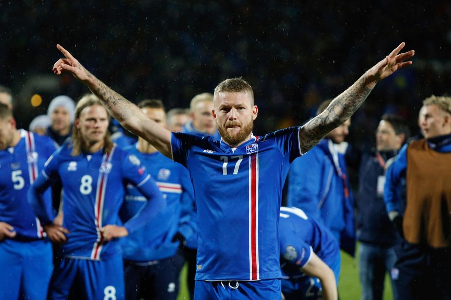 FILE - In this Monday Oct. 9, 2017 filer, Iceland&#x27;s captain Aron Gunnarsson celebrates at the end of the World Cup Group I qualifying soccer match between Iceland and Kosovo in Reykjavik, Iceland. (AP Photo/Brynjar Gunnarsson, File )