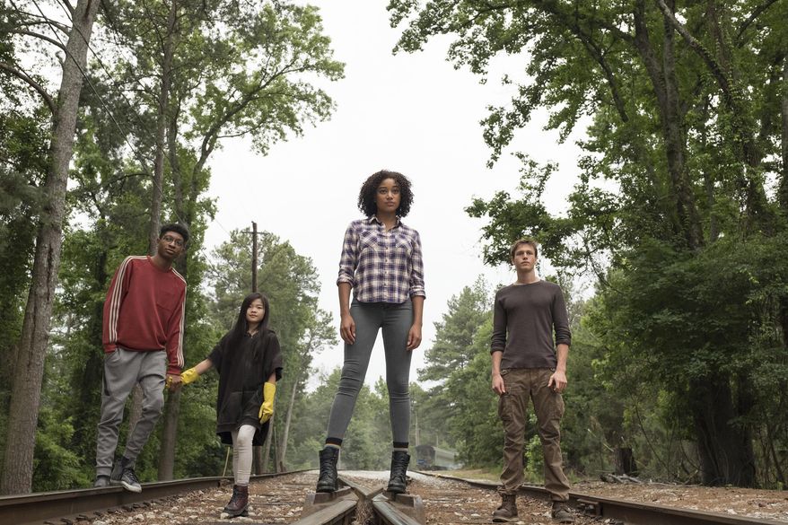 This image released by 20th Century Fox shows, from left, Skylan Brooks, Miya Cech, Amandla Stenberg and Harris Dickinson in a scene from, "The Darkest Minds." The film, directed by Jennifer Yuh Nelson, is expected in theaters on August 3. (Daniel McFadden/20th Century Fox via AP)