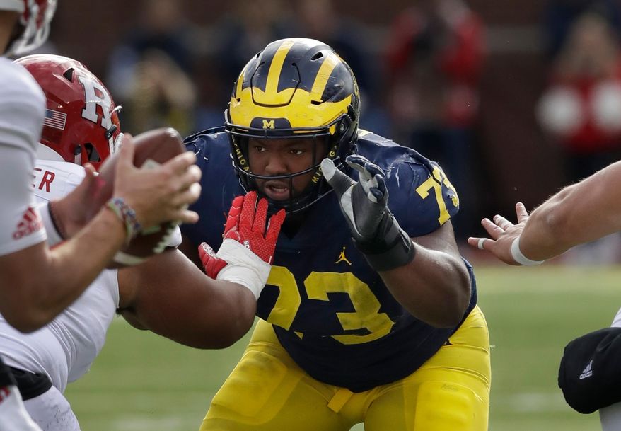 FILE - In this Oct. 28, 2017 file photo Michigan defensive lineman Maurice Hurst (73) goes up against the Rutgers line during the first half of an NCAA college football game in Ann Arbor, Mich. The Oakland Raiders traded up in the fifth round on Saturday, April 28, 2018 to take Hurst, who fell from a projected first-round pick to off some draft boards due to concerns from a heart condition that got him sent home from the combine. (AP Photo/Carlos Osorio, file)