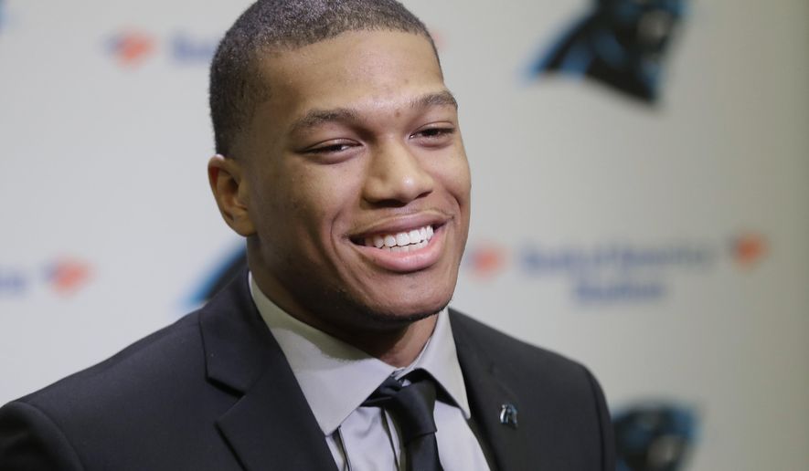 Carolina Panthers&#x27; number one draft choice D.J. Moore smiles as he answers a question during an NFL Football news conference in Charlotte, N.C., Friday, April 27, 2018. (AP Photo/Chuck Burton)