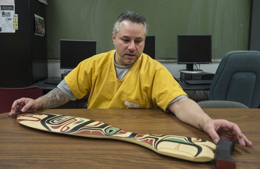 ADVANCE FOR WEEKEND EDITIONS, APRIL 28-29 - In this photo taken April 13, 2018, Kenny Smith talks about learning to carve at Lemon Creek Correctional Center in Juneau, Alaska. At first, Kenny Smith started making artwork out of boredom. The days are long and there's not much to do at the center. Smith, who was behind bars for nine years before being released this past week, began going to the prison's hobby art shop a few years ago just to have something to do. He made little boxes and simple items, sometimes sending them to his mother in Wasilla. (Michael Penn/The Juneau Empire via AP)