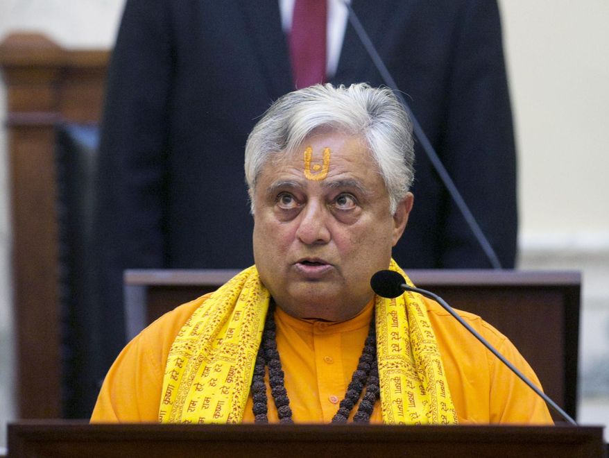 FILE - In this March 3, 2015, file photo, Rajan Zed, president of Universal Society of Hinduism, delivers a prayer from Sanskrit scriptures before the Idaho Senate in Boise. The spiritual leader from Nevada is expected to deliver the first-ever Hindu prayer in the Oklahoma Senate Monday, April 30, 2018, part of an interfaith effort in a Legislature that has faced some criticism for its lack of religious diversity. (Kyle Green/Idaho Statesman via AP, File)