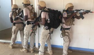 In this photo taken Friday, April 13, 2018. Nigerien police who are part of the U.S. Special Program for Embassy Augmentation and Response, known as SPEAR take part in the annual U.S.-led Flintlock exercise in Niamey, Niger. Amid questions over the role of the U.S. military in West Africa&#39;s vast Sahel region, the State Department is pouring millions of dollars into training local law enforcement officers in the hopes that extremism can be better countered at the community level. (AP Photo/Carley Petesch)