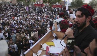 In this Sunday, April 22, 2018 photo, Manzoor Pashteen, a leader of Pashtun Protection Movement addresses his supporters during a rally in Lahore, Pakistan. A Pakistani rights group in the country&#x27;s troubled border region has been protesting police brutality, censorship and disappearances, drawing a police campaign against its members and deepening tensions. (AP Photo/K.M. Chaudary)