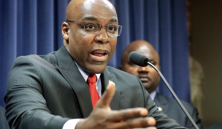 FILE - In this Aug. 12, 2015, file photo, Illinois State Sen. Kwame Raoul, D-Chicago, speaks during a news conference at the Capitol, in Springfield, Ill. Lawmakers and police still can&#39;t agree on the results of an Illinois racial profiling measure first pushed by then-state Sen. Barack Obama. The discussion comes as Democrats now push to make the temporary program permanent. Raoul is the sponsor of the plan. (AP Photo/Seth Perlman, File)