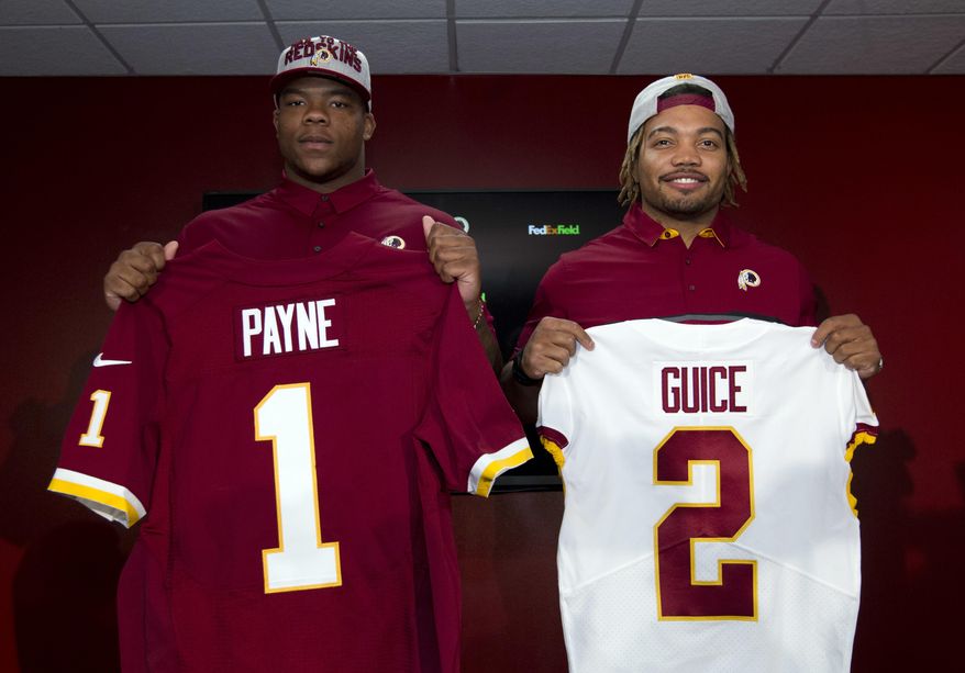 Redskins players Da'Ron Payne and Derrius Guice first and second round of the 2018 NFL Draft hold up their jerseys at a news conference, during Redskins 2018 Draft Fest, in Landover, Md., Saturday, April 28, 2018. ( AP Photo/Jose Luis Magana) **FILE**