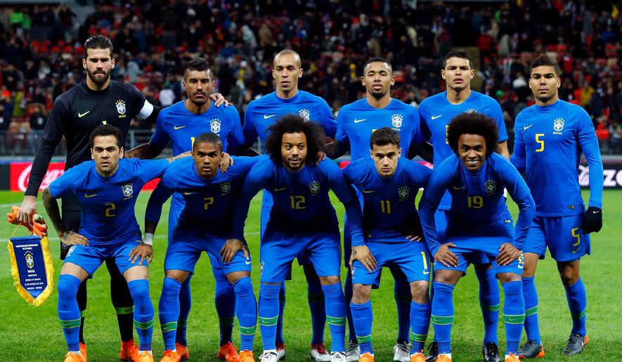 In this photo taken on Friday, March 23, 2018, the Brazilian players pose before an international friendly soccer match between Russia and Brazil at the Luzhniki stadium in Moscow. (AP Photo/Alexander Zemlianichenko)