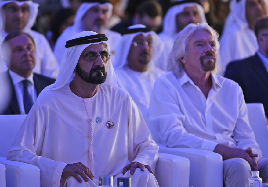 Dubai ruler Sheikh Mohammed bin Rashid Al Maktoum, the Emirates&#x27; vice president and prime minister, left, next to Richard Branson watch the Hyperloop One presentation aboard the Queen Elizabeth 2 in Dubai, United Arab Emirates, Sunday, April 29, 2018. DP World&#x27;s chairman and CEO Sultan Ahmed bin Sulayem said Sunday that Virgin Hyperloop One would launch a freight service called DP World Cargospeed.  (AP Photo/Kamran Jebreili)