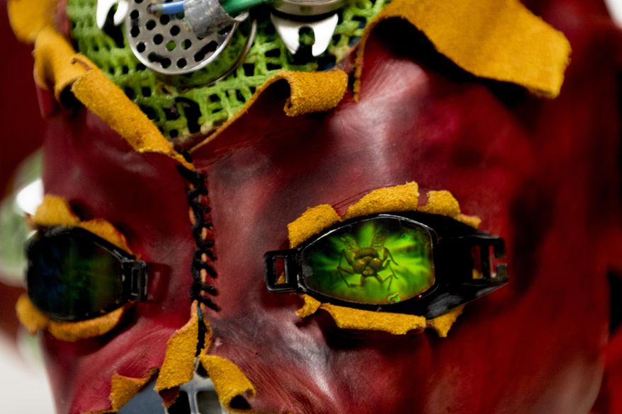 In a Wednesday, April 11, 2018 photo shows a decorated mask crafted by Marianne Custer at the Clarence Brown Theatre costume shop in Knoxville, Tenn. Custer is resident designer of the University of Tennessee Clarence Brown Theatre, a UT theater professor and head of the department's Master of Fine Arts design program. She is retiring after more than 35 years as costume designer at the theatre. (Calvin Mattheis/Knoxville News Sentinel via AP)