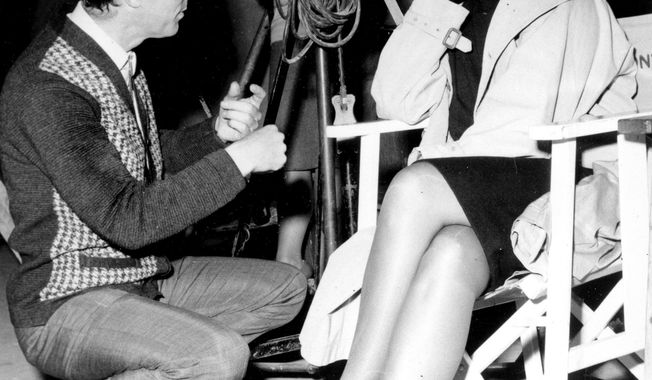 FILE - In this on Dec. 10, 1964, file photo, film director Michael Anderson talks with Sophia Loren on the set of &amp;quot;Operation Crossbow&amp;quot; at MGM&#x27;s British Studios at Elstree in Borehamwood near London, England. British director, whose films included war epic &amp;quot;The Dam Busters&amp;quot; and sci-fi classic &amp;quot;Logan&#x27;s Run,&amp;quot; has died of heart failure on April 25 at his home on the Sunshine Coast of British Columbia. Anderson&#x27;s big-budget, all-star adventure &amp;quot;Around the World in 80 Days,&amp;quot; won five Academy Awards in 1957, including best picture. He was 98. (AP Photo, File)