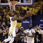 Golden State Warriors&#x27; Andre Iguodala, top, grabs a rebound against the New Orleans Pelicans during the first half in Game 1 of an NBA basketball second-round playoff series Saturday, April 28, 2018, in Oakland, Calif. (AP Photo/Marcio Jose Sanchez)