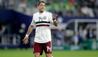 In this image taken on Tuesday, March 27, 2018 Mexico forward Javier Hernandez jogs across the field talking to an official, not pictured, during a international friendly soccer match against Croatia in Arlington, Texas, Tuesday, March 27, 2018. (AP Photo/Tony Gutierrez)