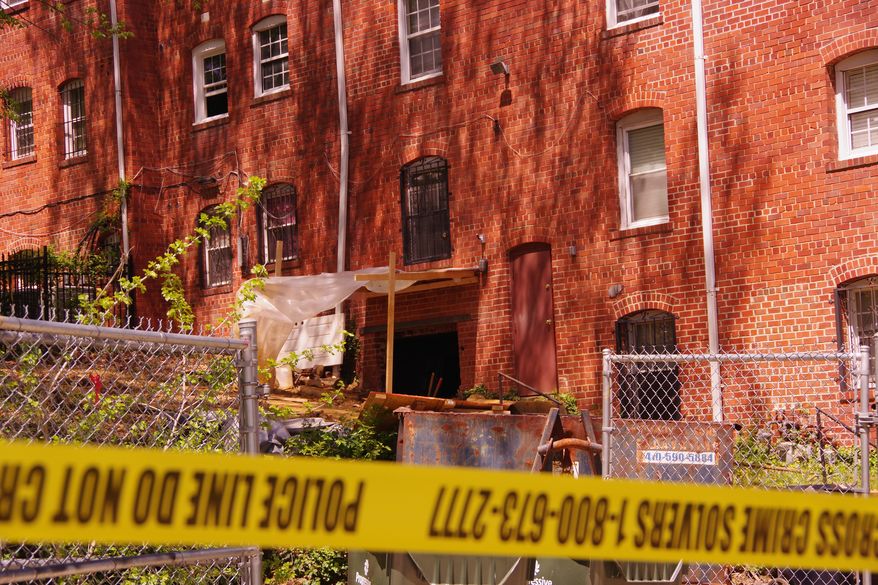 D.C. police have cordoned off a Southeast apartment complex in Congress Heights, where the skeletal remains of three women had been uncovered since Wednesday. "The manner of death is still outstanding," said Dr. Roger A. Mitchell Jr., D.C.'s chief medical examiner. "Once you're beyond a year, it's very difficult to gauge." (Julia Airey/The Washington Times)