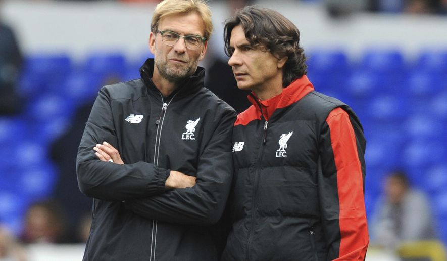 FILE - In this file photo dated Saturday, Oct. 17, 2015, Liverpool manager Juergen Klopp, left, talks with assistant manager Zeljko Buvac before their English Premier League soccer match against Tottenham Hotspur at the White Hart Lane in London. Liverpool’s assistant coach Buvac, is spending some time away from the team until the end of the season for personal reasons, it is announced Monday April 30, 2018, potentially disrupting the team’s bid to qualify for the Champions League final this week. (AP Photo/Rui Vieira, FILE)