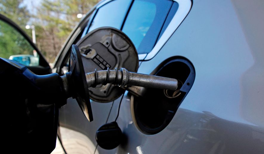 In this April 23, 2018, photo, a car is filled with gasoline at a station in Windham, N.H. Crude oil prices are at the highest level in more than three years and expected to climb higher, pushing up gasoline prices along the way. (AP Photo/Charles Krupa)