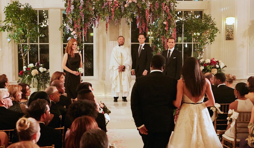 This image released by USA Network shows a wedding scene from the &amp;quot;Good-Bye&amp;quot; episode of &amp;quot;Suits.&amp;quot; Meghan Markle’s character dreams of getting married at the Plaza Hotel in New York City, though the scene was filmed at the Fairmont Royal York in Toronto. Both hotels are hosting royal-themed events in honor of Markle’s wedding to Prince Harry. (Ian Watson/USA Network via AP)