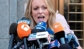 In this April 16, 2018 photo, adult film actress Stormy Daniels outside federal court in New York.  Stormy Daniels filed a defamation complaint in federal court in New York on Monday. At issue is a tweet Trump made in which he dismissed a composite sketch that Daniels says depicts a man who threatened her in 2011 to stay quiet about her alleged sexual encounter with Trump.  (AP Photo/Mary Altaffer)